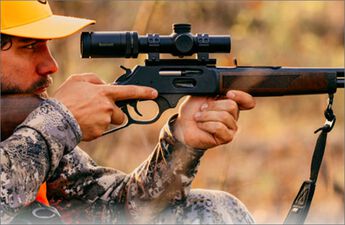 Target shooter adjusting Match Pro ED Riflescope